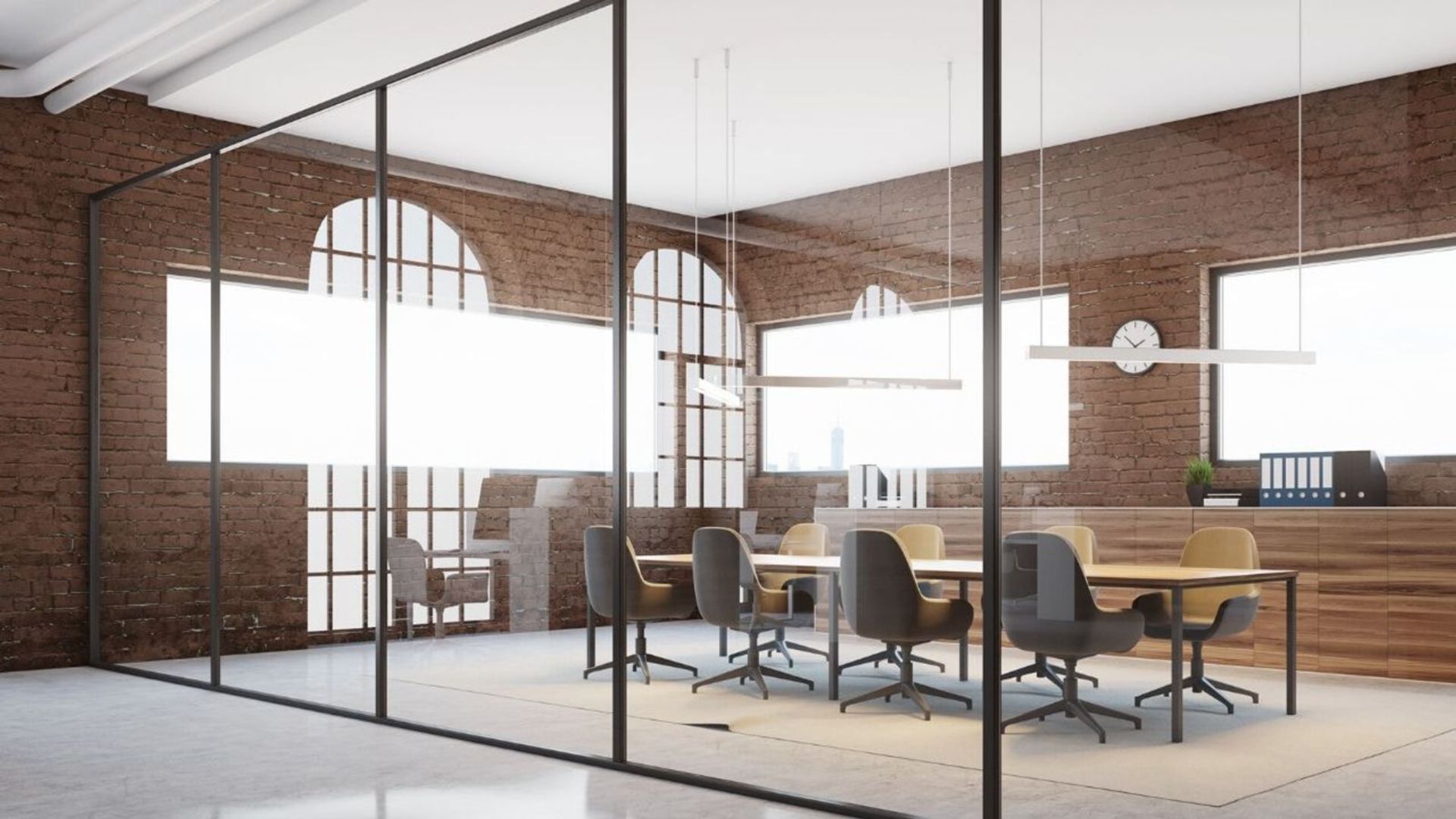Modern glass-walled office with brick walls, conference table, and arched windows
